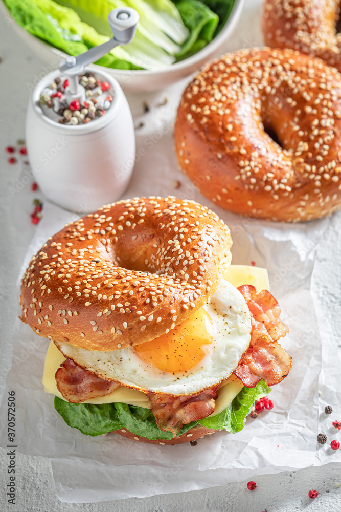 Delicious bagel with egg and bacon for breakfast Delicious bagel with egg and bacon for breakfast