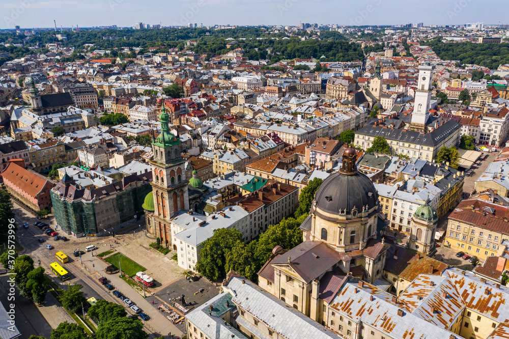 Aerial view of historical old city district of Lviv, Ukraine. Churches, cathedrals, city hall and houses roofs in old lviv.