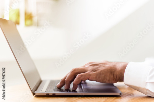 man working on laptop computer