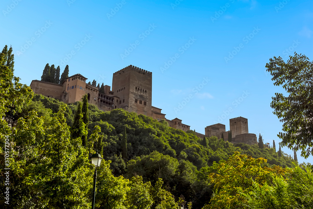 A view from the Aljibillo bridge towards the Alhambra in Granada, Spain in the summertime
