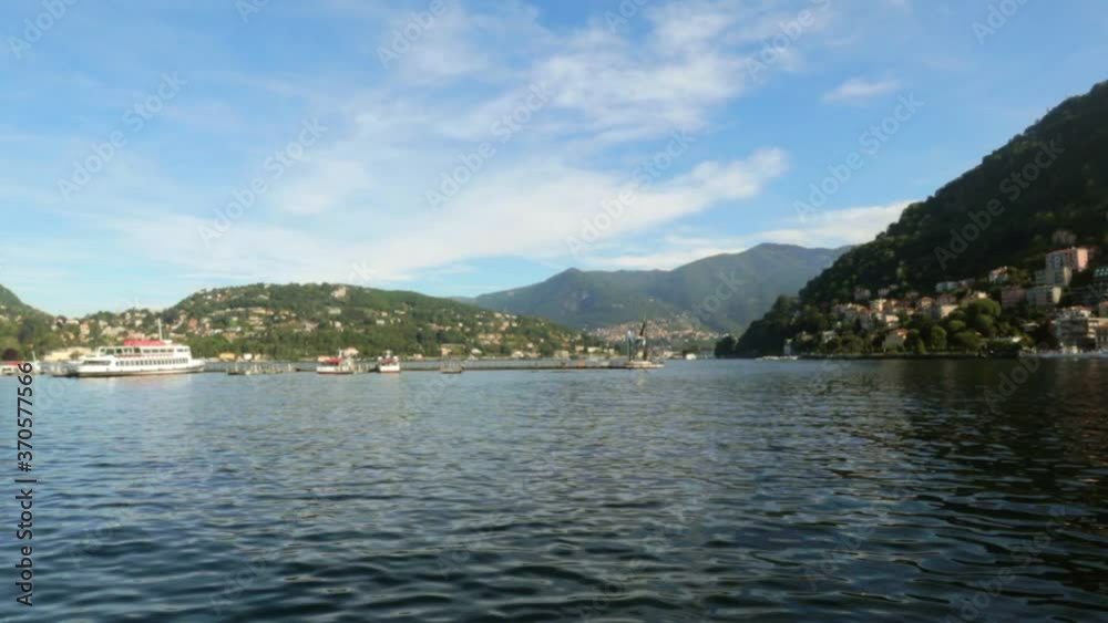 Beautiful lake with houses on the base of the mountains in Italy Beautiful lake with houses on the base of the mountains in Italy