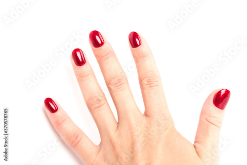 Stylish trendy female manicure. red manicure nails on white background