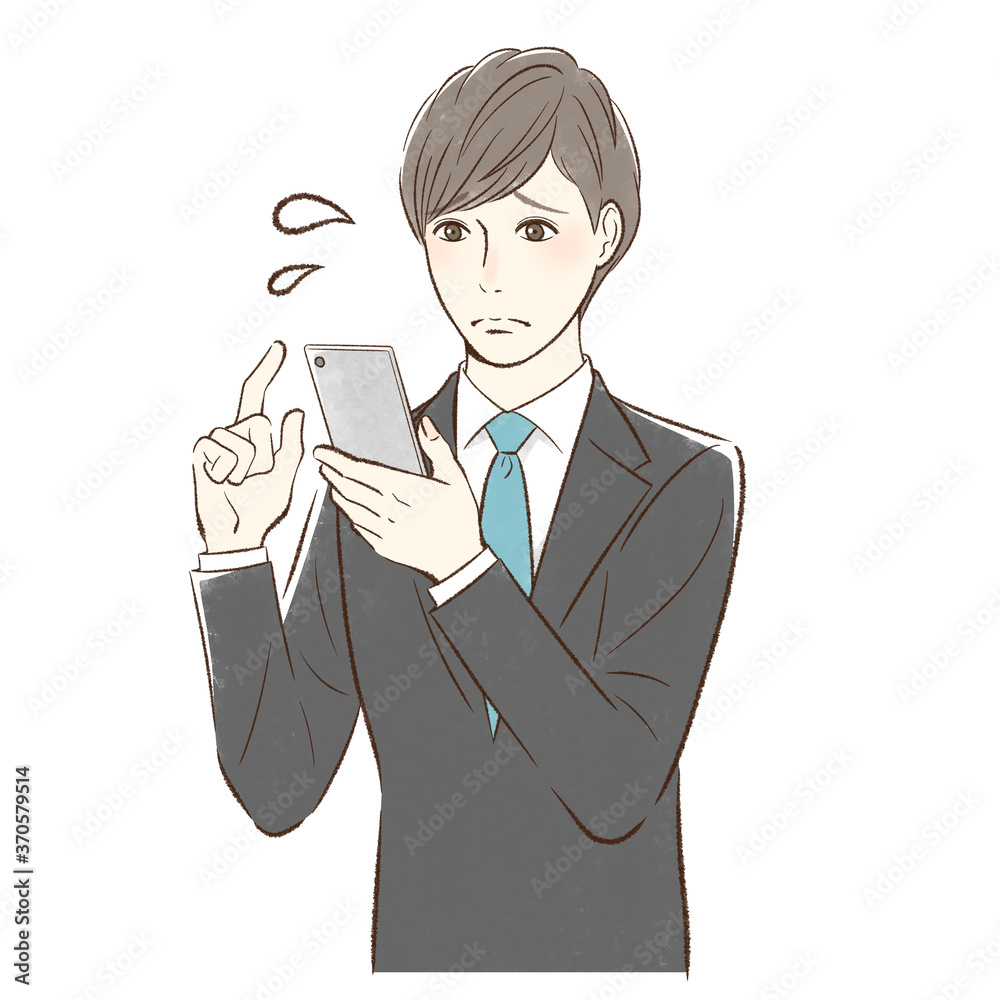 不安そうにスマホを操作する男性 不安そうにスマホを操作する男性