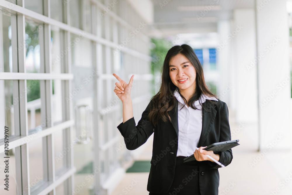 Beautiful young asian woman holding tablet pc Beautiful young asian woman holding tablet pc
