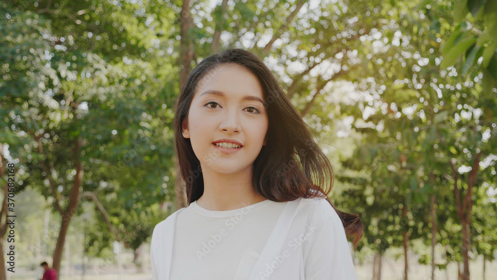 Authentic close up Happy pretty asian woman. Enjoy the nature in garden for summer. End of quarantine and return to Travel around the world Authentic close up Happy pretty asian woman. Enjoy the nature in garden for summer. End of quarantine and return to Travel around the world