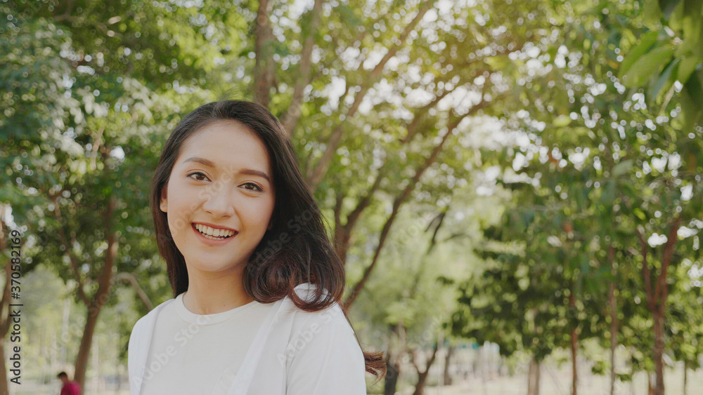 Authentic close up Happy pretty asian woman. Enjoy the nature in garden for summer. End of quarantine and return to Travel around the world Authentic close up Happy pretty asian woman. Enjoy the nature in garden for summer. End of quarantine and return to Travel around the world