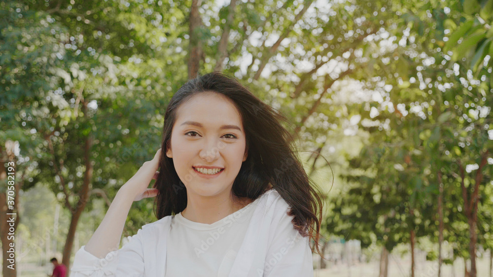 Authentic close up Happy pretty asian woman. Enjoy the nature in garden for summer. End of quarantine and return to Travel around the world Authentic close up Happy pretty asian woman. Enjoy the nature in garden for summer. End of quarantine and return to Travel around the world