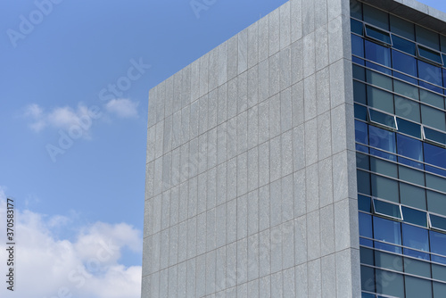 end face of office building on sky background