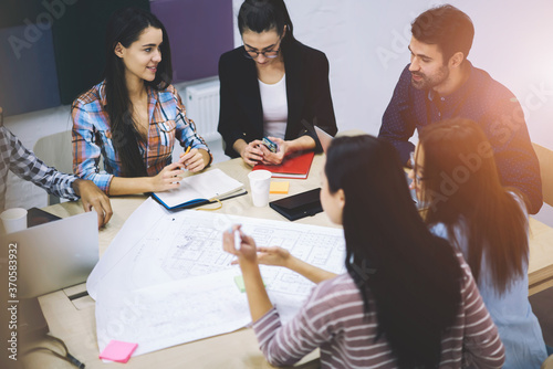 Diversity group of talented engineers actively discussing business startup project ideas and surfing information using modern technology,hipster guys talking in friendly atmosphere during work break