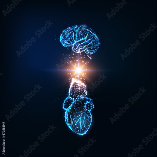 Futuristic emotional intelligence concept with glowing low polygonal human brain and heart photo