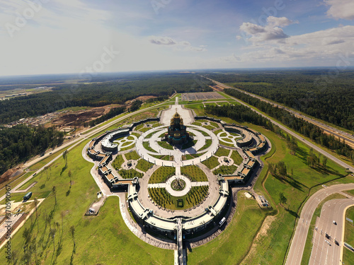 dark color temple with golden domes with geometric park from drone height