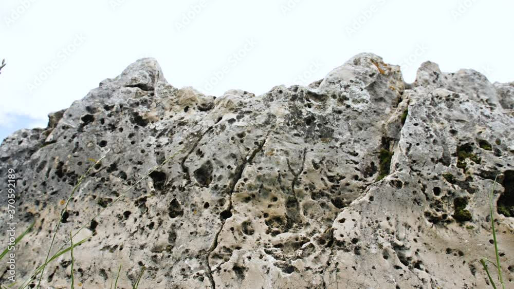 Raw gray stone texture, rock close-up. Raw gray stone texture, rock close-up.