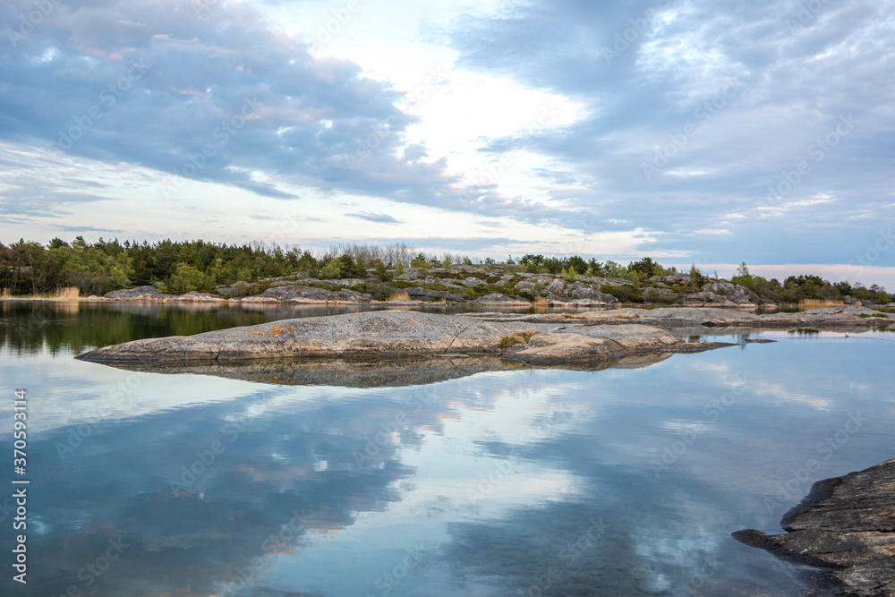 Coastal view in the evening, rocks, sea and reflection, Kumlinge, Aland islands, Finland