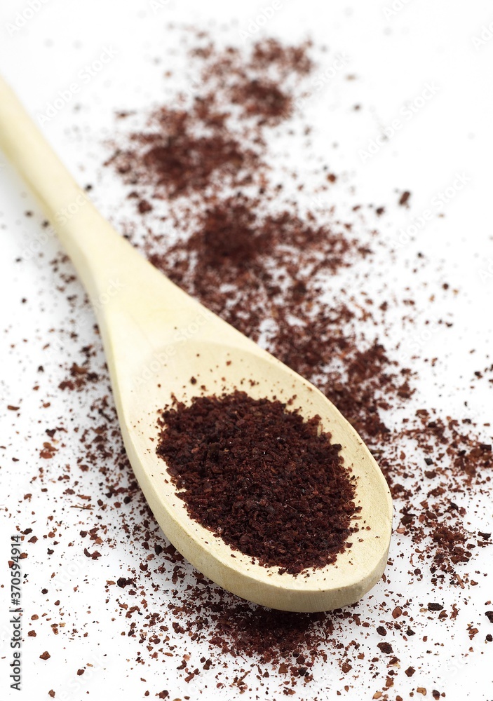 Powder of Sumac, rhus coriaria, Spice against White Background Powder of Sumac, rhus coriaria, Spice against White Background
