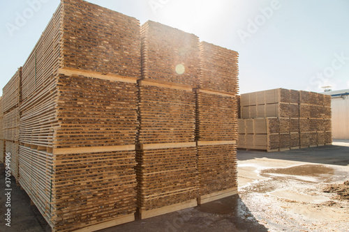 A pallet of boards in an industrial sawmill warehouse