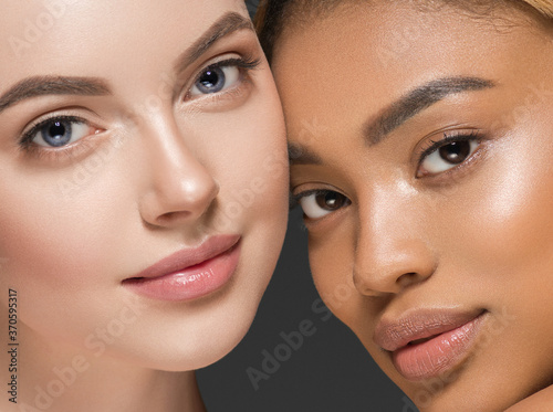 Different ethnic american african and caucasian woman beauty face portrait