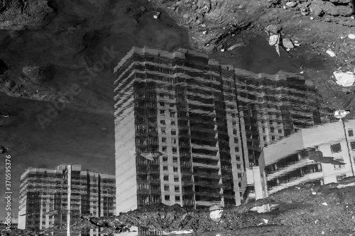 new apartment house puddle reflection