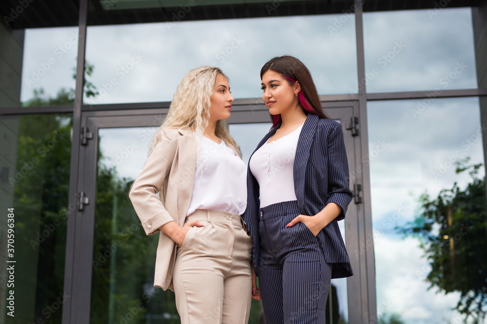 two beautiful young women in suits two beautiful young women in suits