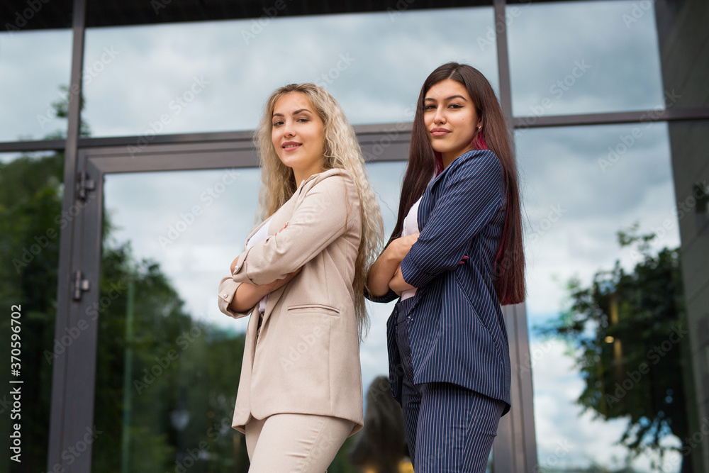 two beautiful young women in suits two beautiful young women in suits