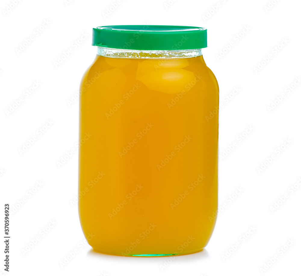 Glass jar of honey on white background isolation Glass jar of honey on white background isolation