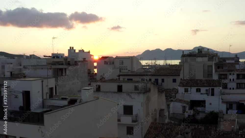 AERIAL: Small City with Port on Tropical Island with Boats and Ocean at Small Town at Sunrise with Mountains in Background Vacation, Travel, Sunset AERIAL: Small City with Port on Tropical Island with Boats and Ocean at Small Town at Sunrise with Mountains in Background Vacation, Travel, Sunset