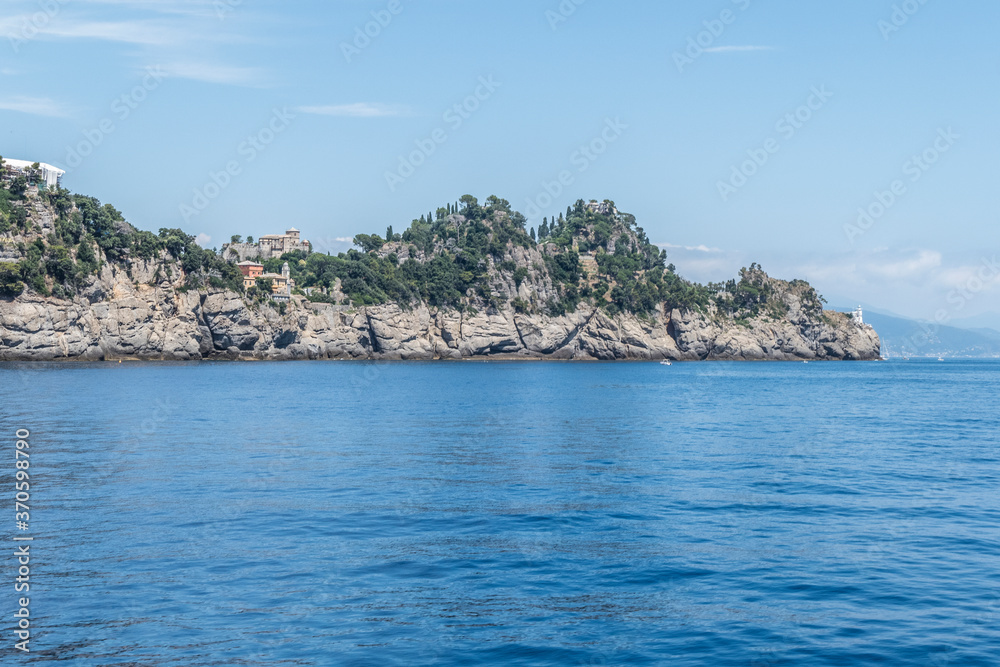 the coast of Portofino with the castle and the lighthouse the coast of Portofino with the castle and the lighthouse
