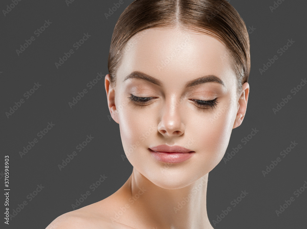 Beautiful face woman healthy skin gray background Beautiful face woman healthy skin gray background