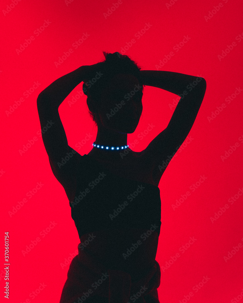 silhouette of a woman in red