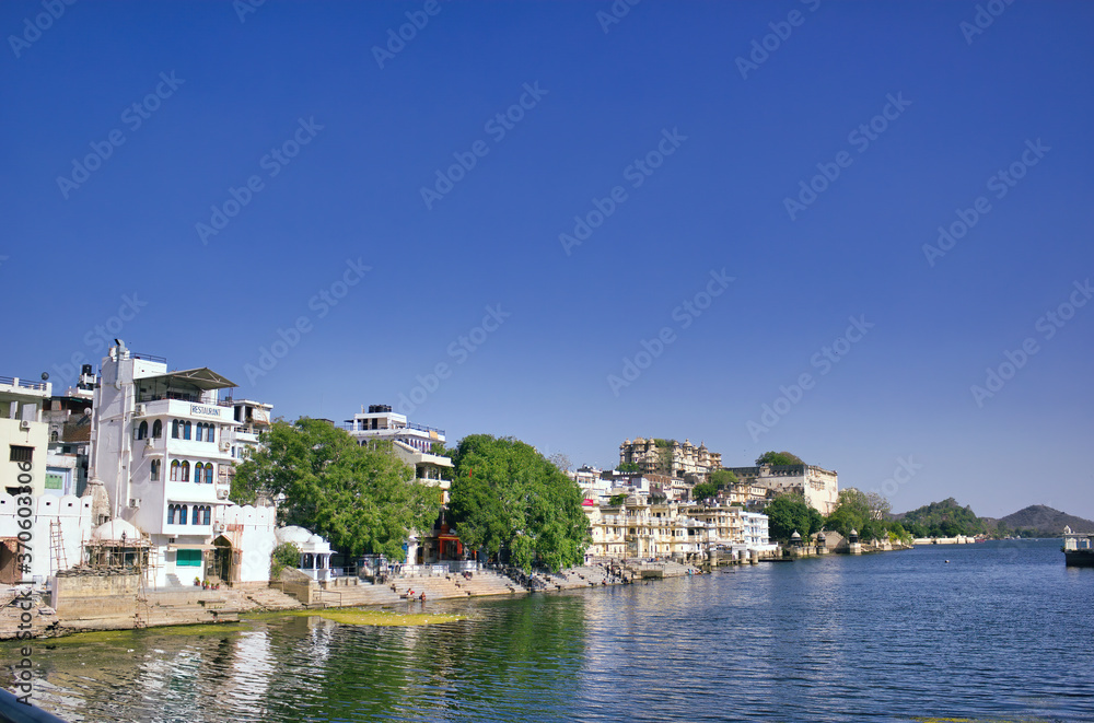 Indian Houses next to a lake located in Udaipur city in Rajasthan state, India