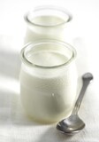 Glasses of Natural Yoghurt against White Background