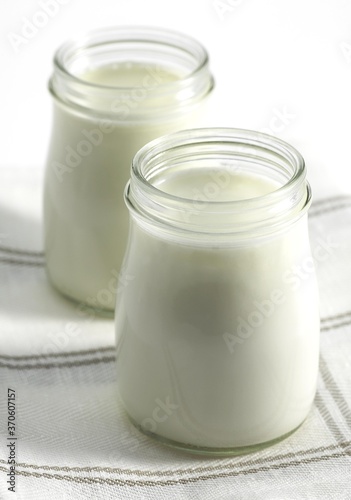 Glasses of Natural Yoghurt against White Background