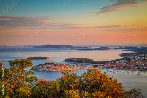 Panoramic view of Adriatic coast with The Primosten town at the colorful dawn of the day, Croatia, Europe.