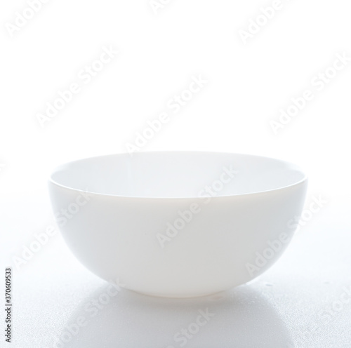 White plate on a white background, close-up