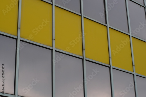glass facade with yellow elemants