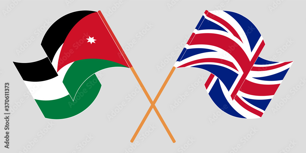Crossed and waving flags of Jordan and UK