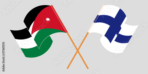 Crossed and waving flags of Jordan and Finland