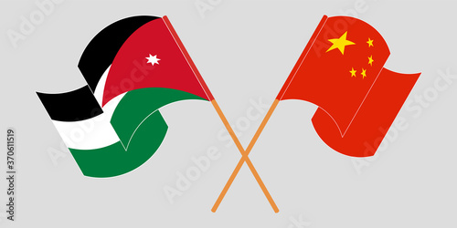 Crossed and waving flags of Jordan and China