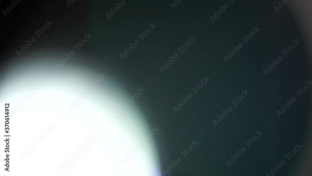 different light leaks or lens flares on black background shot at 50p ...