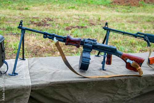 Degtyarev RPD hand machine gun, mounted on a table covered with a raincoat, image for magazines and articles about military equipment.