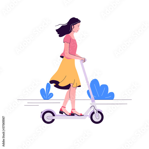 Young woman with long hair rides electric scooter