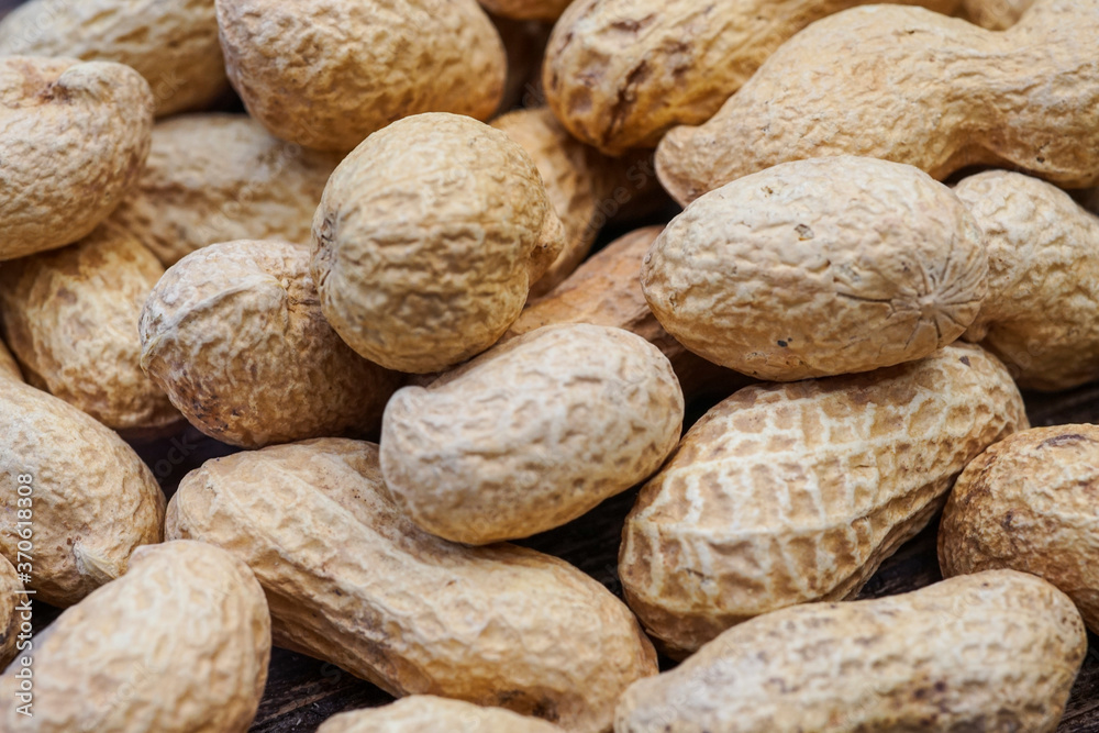 dry peanuts in peel texture close up