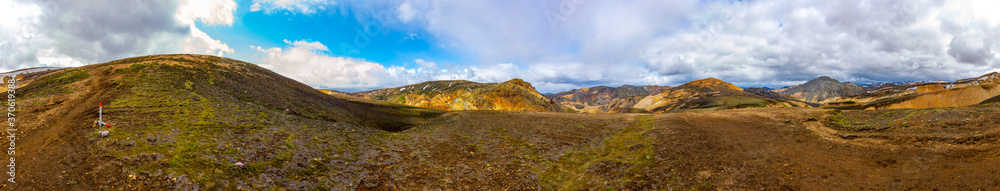 Icelandic volcanic mountain landscape in panorama. Hiking trail laugavegur in Fjallabak Icelandic volcanic mountain landscape in panorama. Hiking trail laugavegur in Fjallabak