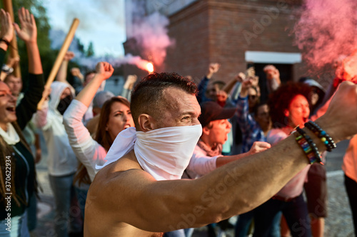 Canvas Print Angry crowd of people with inflamed torches on public demonstrations