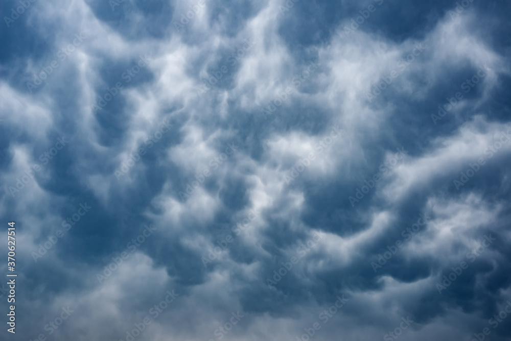 Full-screen texture of abstract dark storm clouds