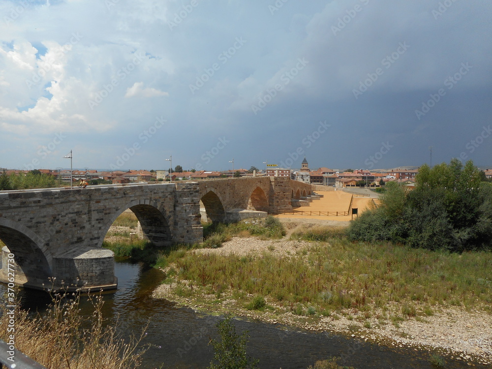 Storm cloud over ancient romanian bridge in Spain