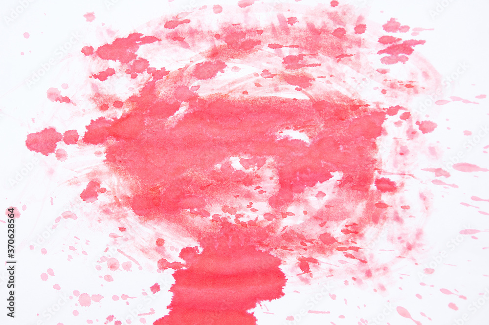 Red abstract stain of watercolor paint on white background.