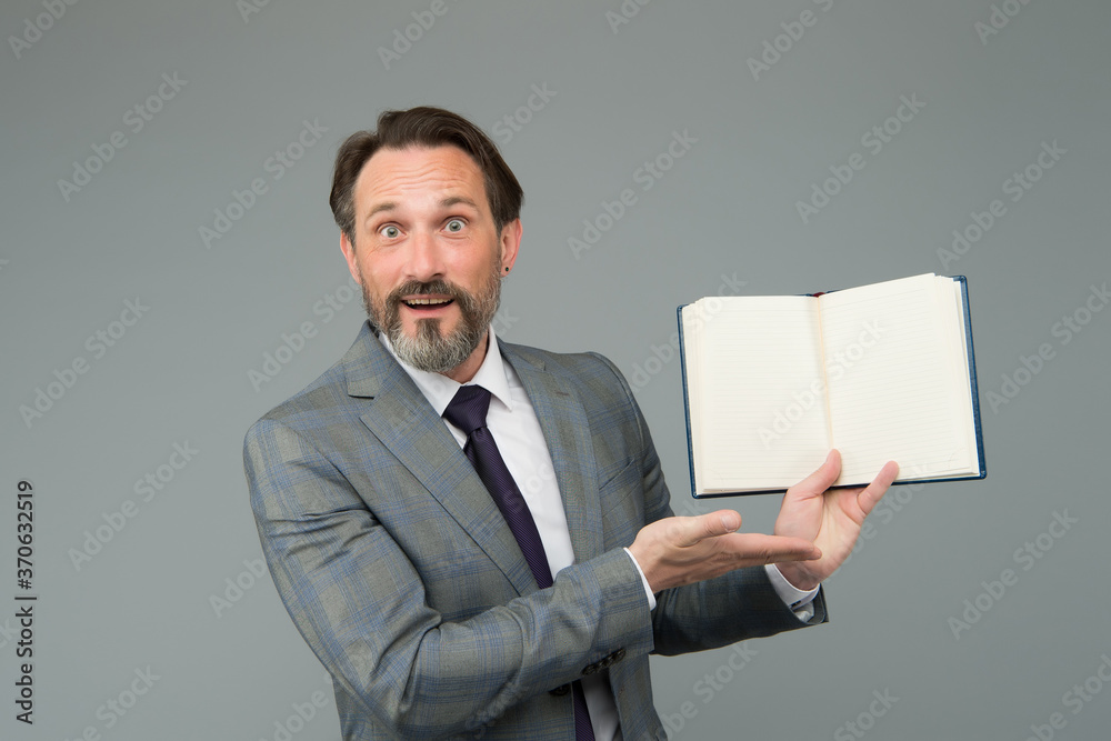 Spreading knowledge. happy man found what he was looking for. businessman is amazed to see inside of book about success. Handsome man reading a book. Business development literature. reading law book Spreading knowledge. happy man found what he was looking for. businessman is amazed to see inside of book about success. Handsome man reading a book. Business development literature. reading law book