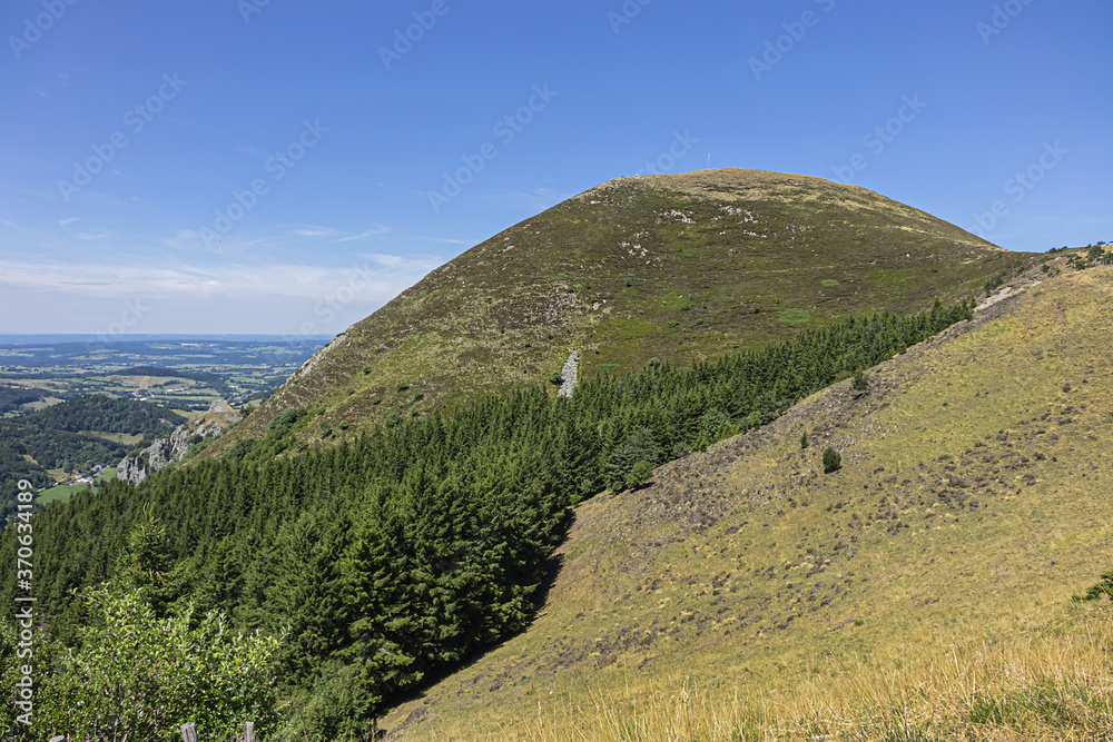 Fototapeta premium Beautiful highland landscapes in Volcans d'Auvergne regional Natural Park. Monts Dore - the heart of the Massif Central, Auvergne-Rhone-Alpes administrative region, France.