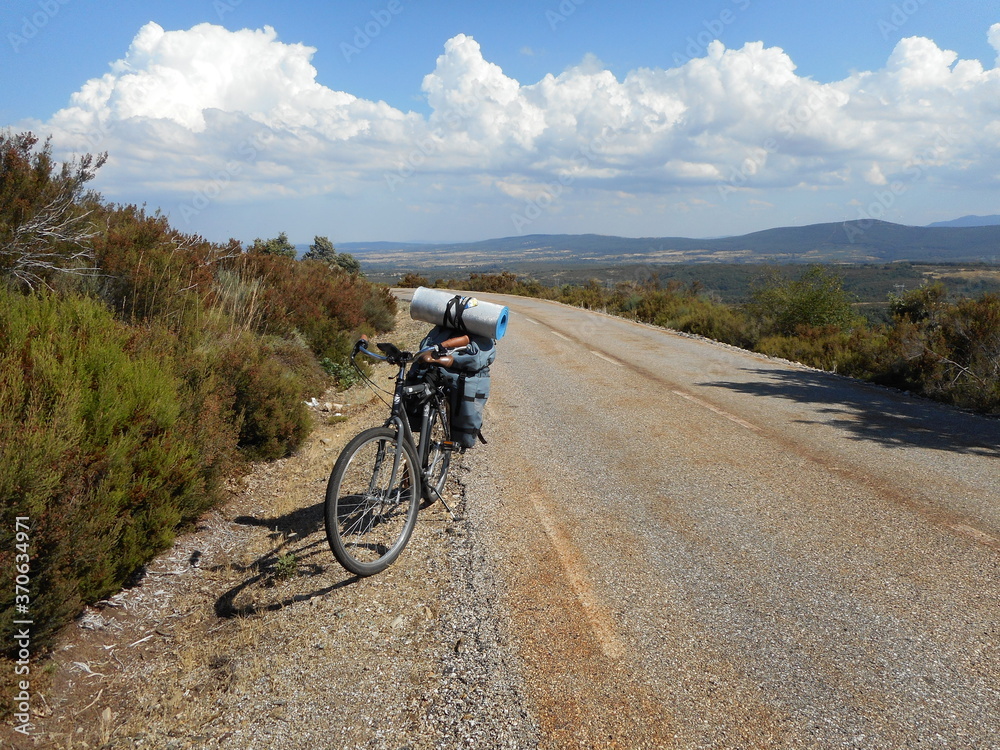 Bicycle on the country mountain road . Spain Bicycle on the country mountain road . Spain
