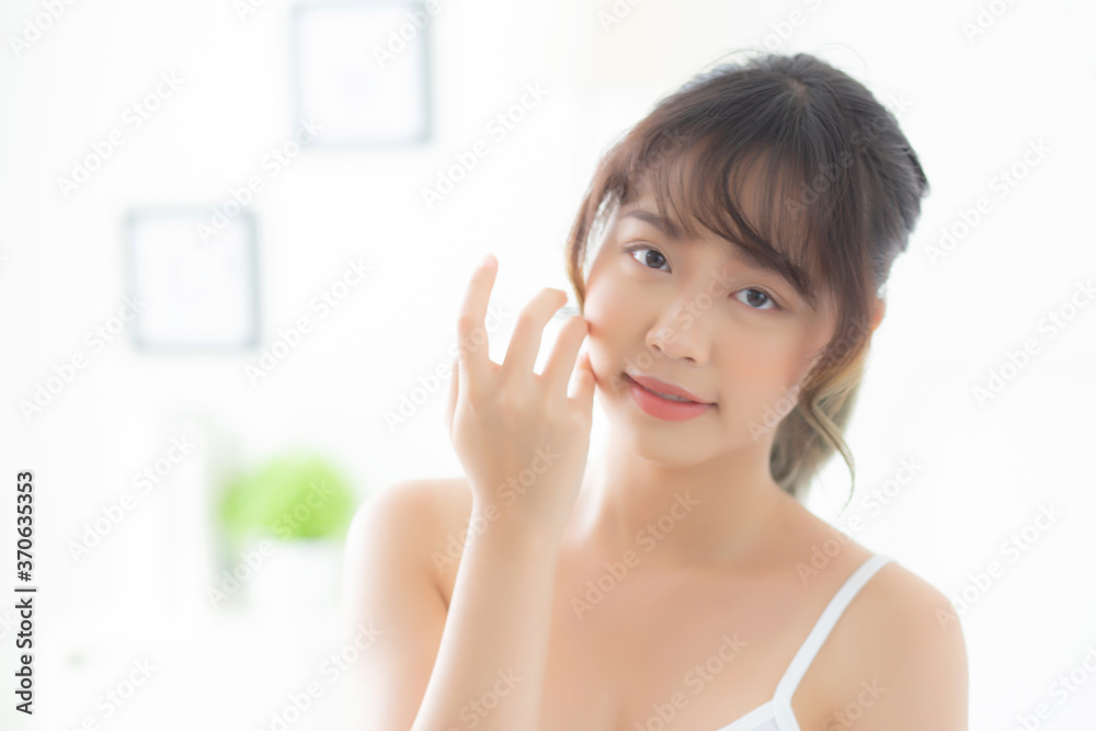 Portrait of beautiful young asian woman smile healthy and wellness at the bedroom, beauty asia girl skin care touch eye makeup and cosmetic with happy with fresh, lifestyle and relax concept. Portrait of beautiful young asian woman smile healthy and wellness at the bedroom, beauty asia girl skin care touch eye makeup and cosmetic with happy with fresh, lifestyle and relax concept.